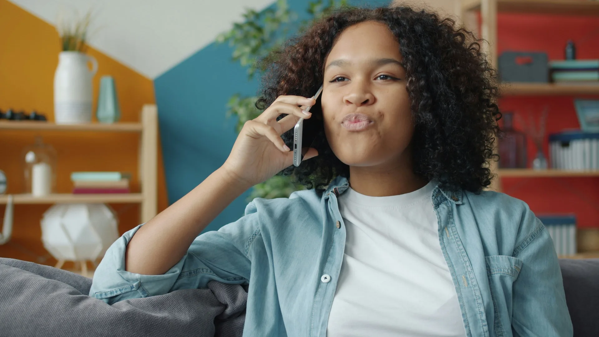 East African professional managing finances on smartphone